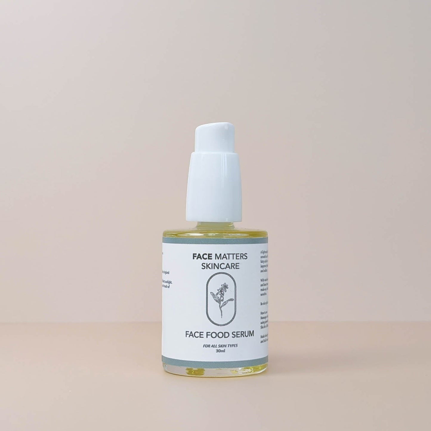 Face Matters Skincare Face Food Serum in a clear glass bottle with a white pump dispenser on a neutral background.