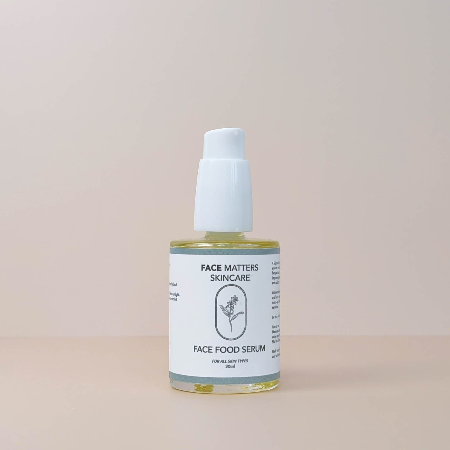 Face Matters Skincare Face Food Serum in a clear glass bottle with a white pump dispenser on a neutral background.